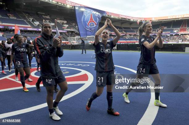 Marie Laure Delie, Veronica Boquete and Irene Paredes of Paris Saint-Germain salute supporters after the Women's Champions League match between Paris...