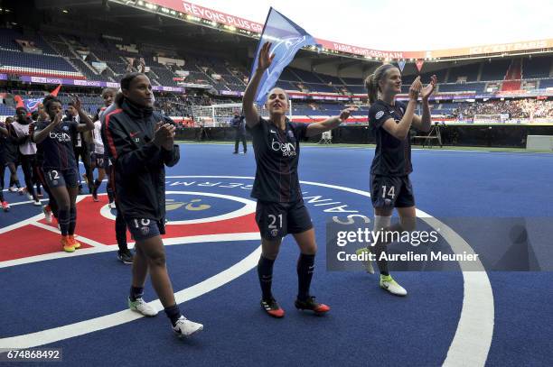 Marie Laure Delie, Veronica Boquete and Irene Paredes of Paris Saint-Germain salute supporters after the Women's Champions League match between Paris...