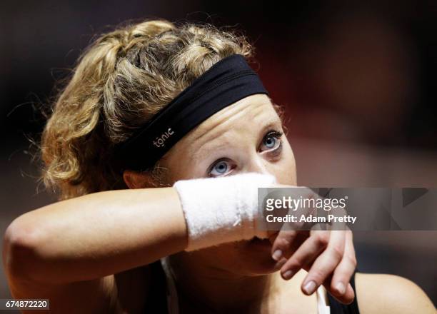 Laura Siegemund of Germany sheds a tear as she celebrates winning match point against Simona Halep of Romania during the Porsche Tennis Grand Prix at...