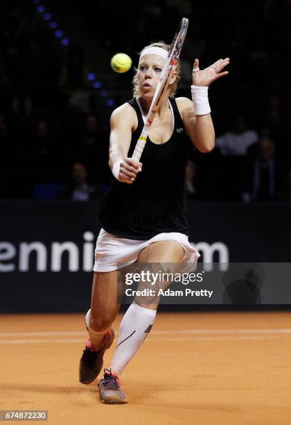 Laura Siegemund of Germany plays a backhand during her match against Simona Halep of Romania during the Porsche Tennis Grand Prix at Porsche Arena on...