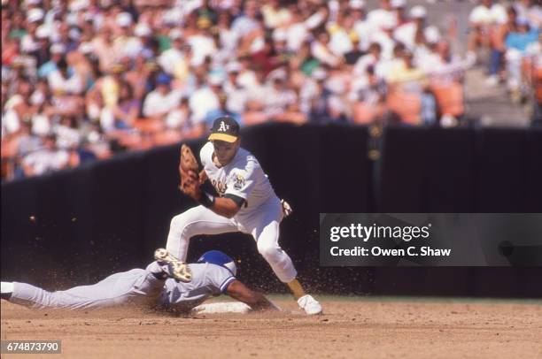 Walt Weiss of the Oakland A's circa 1989 prepares to tag the runner at the Oakland Coliseum in Oakland, California.