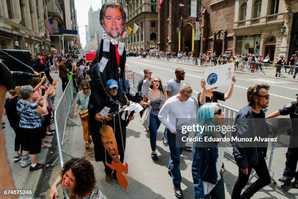 People march against US president Donald Trump as they take part in the '100 Days of Failure' protest on April 29, 2017 in New York City. Activists...