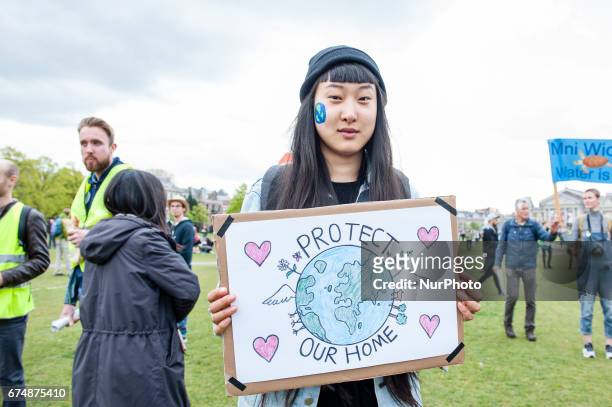 Thousands of people take part in the &quot;People's Climate March&quot; to call for an ambitious climate policy, on April 29, 2017 in Amsterdam. The...