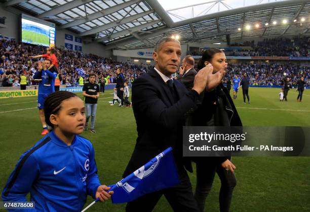 Brighton & Hove Albion manager Chris Hughton celebrates promotion during a parade around the pitch following the Sky Bet Championship match at the...