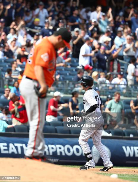 Austin Romine of the New York Yankees rounds the bases after hitting a two run home run against Vidal Nuno of the Baltimore Orioles in the sixth...