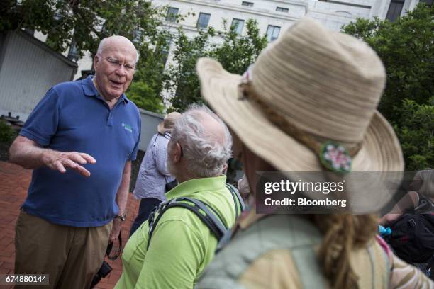 Senator Patrick Leahy, a Democrat from Vermont, left, speaks with members of his constituency during a breakfast reception ahead of the People's...