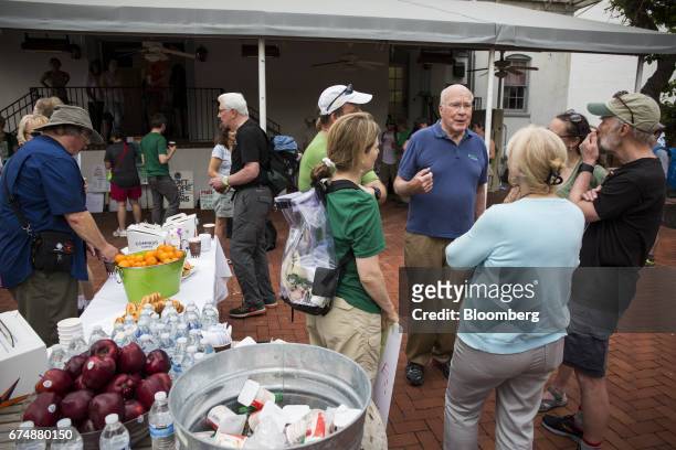 Senator Patrick Leahy, a Democrat from Vermont, center right, speaks with members of his constituency during a breakfast reception ahead of the...