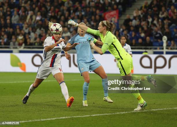 Karen Bardsley of Manchester City clears the ball from Ada Hegerberg of Olympique Lyon during the UEFA Women's Champions League Semi Final second leg...