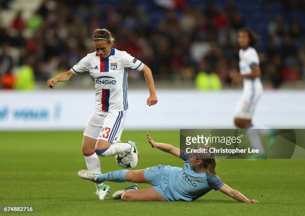Keira Walsh of Manchester City tackles Camille Abily of Olympique Lyon during the UEFA Women's Champions League Semi Final second leg match between...