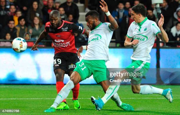 Guingamp's French forward Yannis Salibur vies with Saint-Etienne's French forward Arnaud Nordin and Saint-Etienne's French midfielder Vincent Pajot...