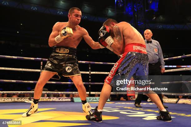 Scott Quigg and Viorel Simion in action during the IBF Featherweight bout at Wembley Stadium on April 29, 2017 in London, England.