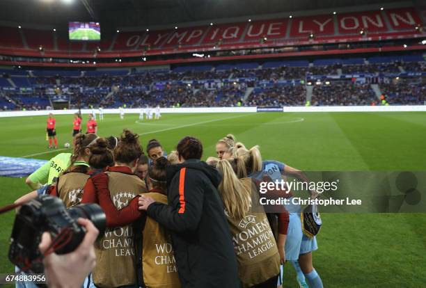 Manchester City players group huddle before kick off during the UEFA Women's Champions League Semi Final second leg match between Olympique Lyon and...