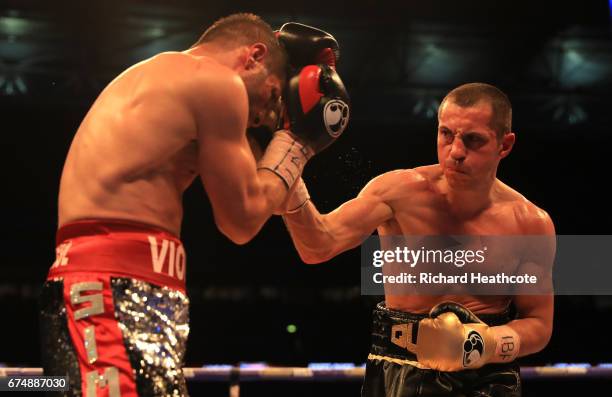 Scott Quigg and Viorel Simion in action during the IBF Featherweight bout at Wembley Stadium on April 29, 2017 in London, England.