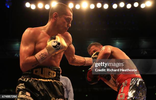 Scott Quigg and Viorel Simion in action during the IBF Featherweight bout at Wembley Stadium on April 29, 2017 in London, England.