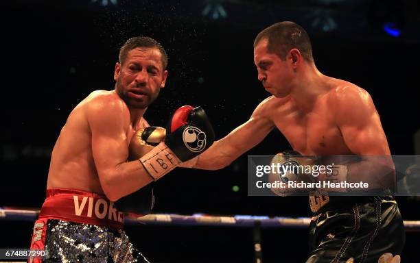 Scott Quigg and Viorel Simion in action during the IBF Featherweight bout at Wembley Stadium on April 29, 2017 in London, England.