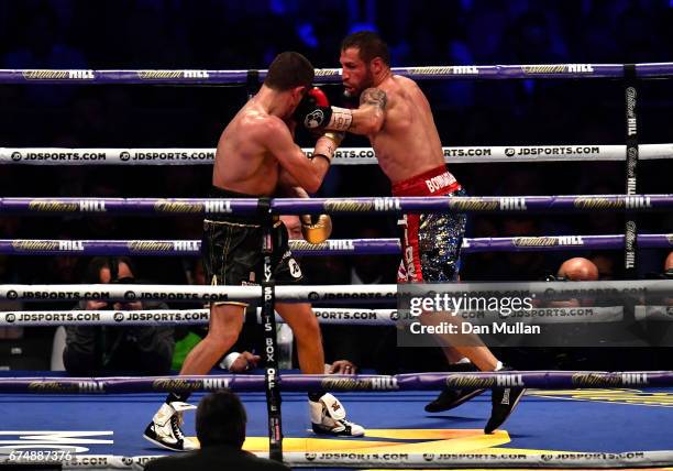 Scott Quigg and Viorel Simion in action during the IBF Featherweight bout at Wembley Stadium on April 29, 2017 in London, England.