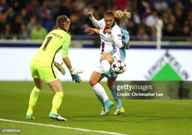 Alex Morgan of Olympique Lyon battles with Steph Houghton and Karen Bardsley of Manchester City during the UEFA Women's Champions League Semi Final...