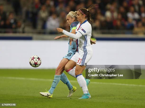 Alex Morgan of Olympique Lyon battles with Steph Houghton of Manchester City during the UEFA Women's Champions League Semi Final second leg match...