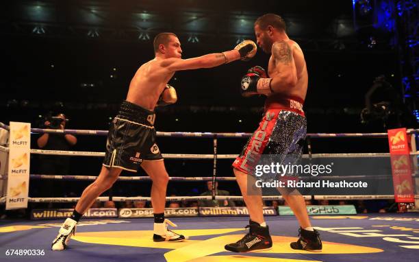 Scott Quigg and Viorel Simion in action during the IBF Featherweight bout at Wembley Stadium on April 29, 2017 in London, England.