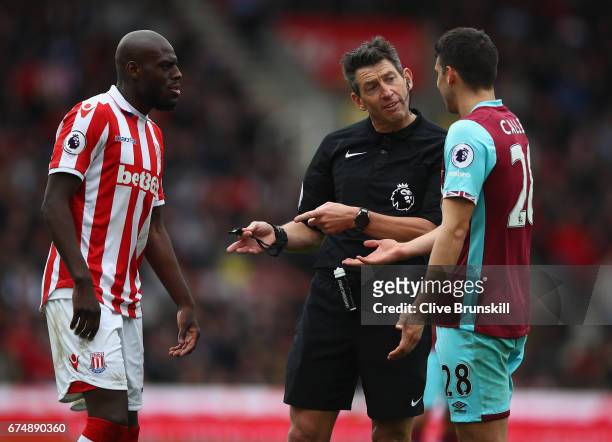 Referee Lee Probert talks to Bruno Martins Indi of Stoke City and Jonathan Calleri of West Ham United during the Premier League match between Stoke...
