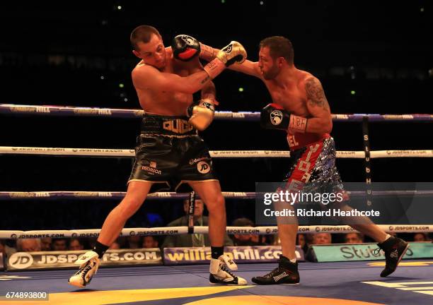 Scott Quigg and Viorel Simion in action during the IBF Featherweight bout at Wembley Stadium on April 29, 2017 in London, England.