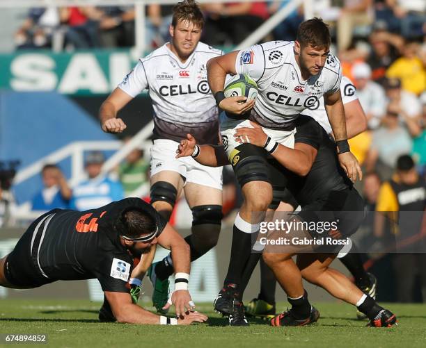 Ruan Botha of Sharks is tackled by Ramiro Herrera of Jaguares during a match between Jaguares v Sharks as part of Super Rugby Rd 10 at Jose...