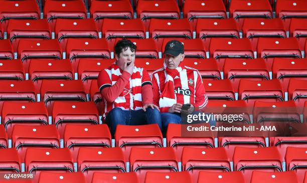 Southampton fans yawn before the Premier League match between Southampton and Hull City at St Mary's Stadium on April 29, 2017 in Southampton,...