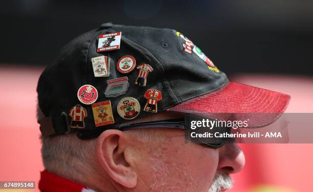 Southampton fan wearing pin badges in his cap during the Premier League match between Southampton and Hull City at St Mary's Stadium on April 29,...