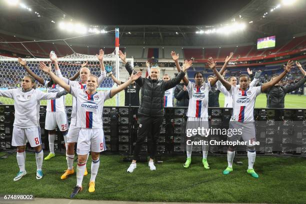 Olympique Lyon players celebrate with their fans at the end of the game during the UEFA Women's Champions League Semi Final second leg match between...