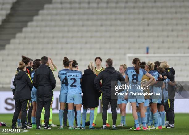 The Manchester City team look dejected after they are knocked out during the UEFA Women's Champions League Semi Final second leg match between...