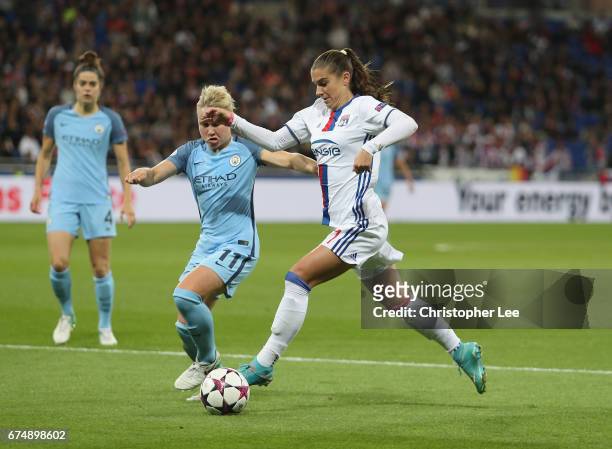 Alex Morgan of Olympique Lyon battles with Isobel Christiansen of Manchester City during the UEFA Women's Champions League Semi Final second leg...