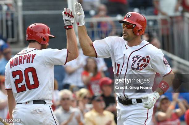 Ryan Zimmerman of the Washington Nationals celebrates with Daniel Murphy after a home run in the eighth inning against the New York Mets at Nationals...