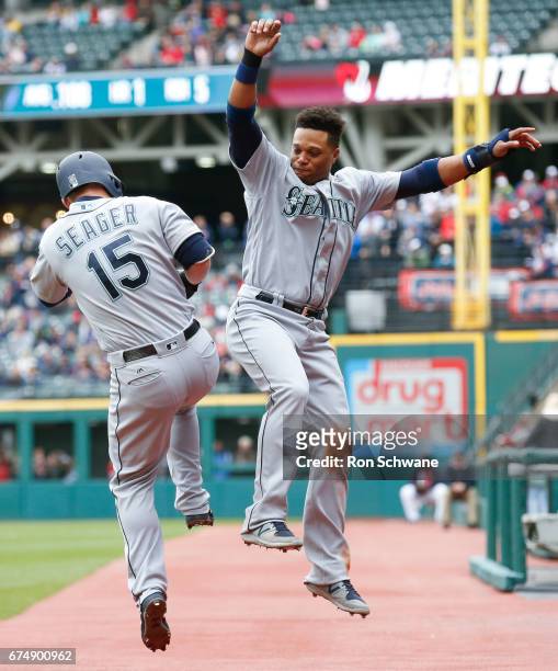 Kyle Seager of the Seattle Mariners celebrates with Robinson Cano after hitting a solo home run off Danny Salazar of the Cleveland Indians during the...