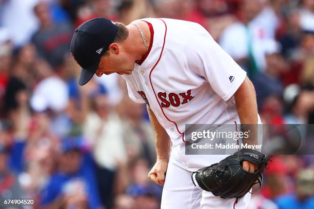 Steven Wright of the Boston Red Sox reacts after Anthony Rizzo of the Chicago Cubs hit a two-run homer during the fourth inning at Fenway Park on...