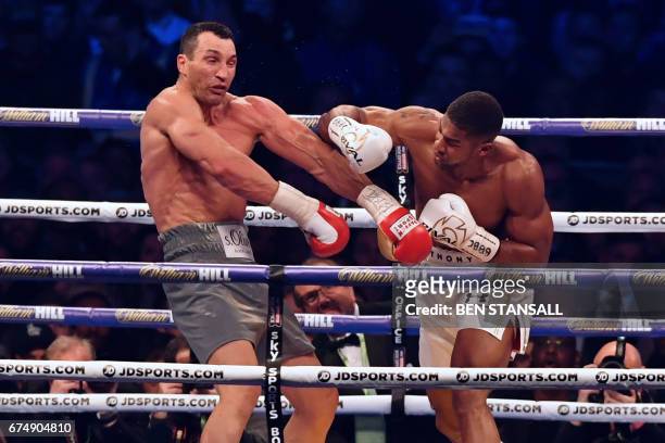 Britain's Anthony Joshua throws a punch at Ukraine's Wladimir Klitschko during the fourth round of their IBF, IBO and WBA, world Heavyweight title...