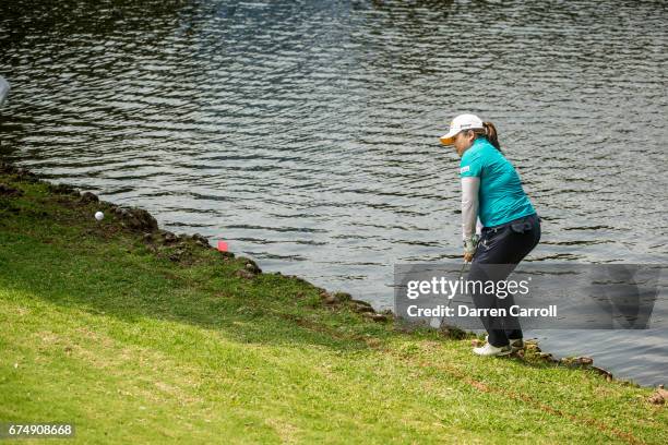 Inbee Park of South Korea plays her second shot frm a hazard near the seventeenth green during the third round of the Volunteers of America North...
