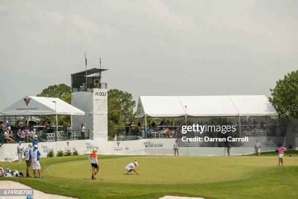 Cristie Kerr of the United States lines up a putt at the eighteenth hole during the third round of the Volunteers of America North Texas Shootout at...