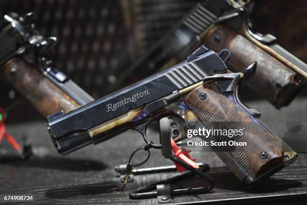 Custom Remington pistols are displayed at the 146th NRA Annual Meetings & Exhibits on April 29, 2017 in Atlanta, Georgia. With more than 800...