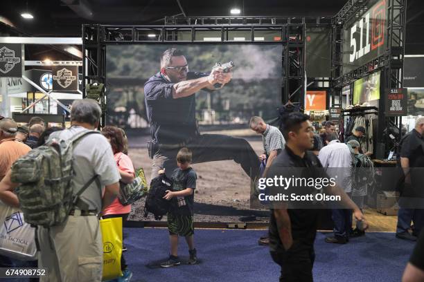 National Rifle Association members visit exhibitor booths at the 146th NRA Annual Meetings & Exhibits on April 29, 2017 in Atlanta, Georgia. With...