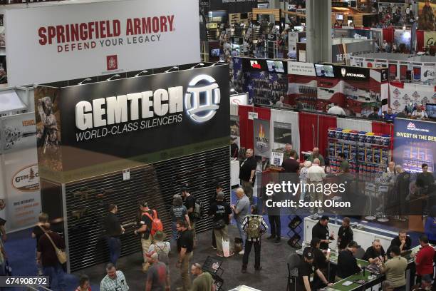 National Rifle Association members visit exhibitor booths at the 146th NRA Annual Meetings & Exhibits on April 29, 2017 in Atlanta, Georgia. With...