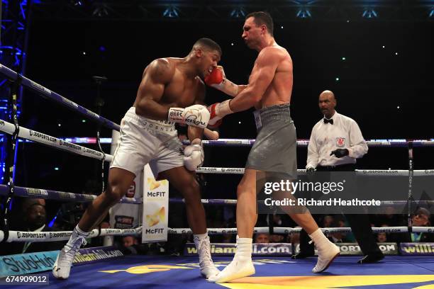 Anthony Joshua and Wladimir Klitschko in action during the IBF, WBA and IBO Heavyweight World Title bout at Wembley Stadium on April 29, 2017 in...