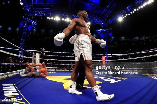 Anthony Joshua reacts after knocking down Wladimir Klitschko during the IBF, WBA and IBO Heavyweight World Title bout at Wembley Stadium on April 29,...
