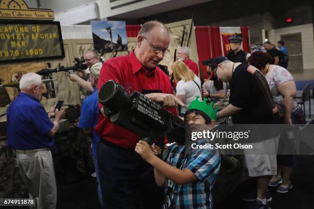 Hunter Nguyen holds a Stinger anti-tank weapon at the 146th NRA Annual Meetings & Exhibits on April 29, 2017 in Atlanta, Georgia. The weapon was...