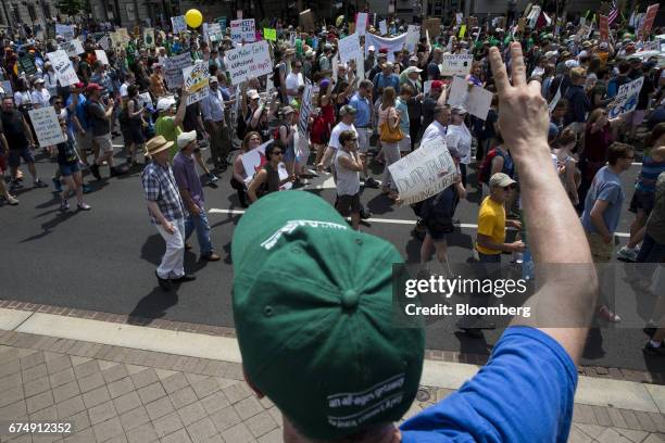 Demonstrator gestures as others march down Pennsylvania Avenue during the People's Climate Movement March in Washington, D.C., U.S., on Saturday,...