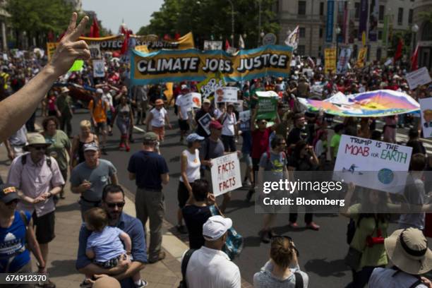 Demonstrator gestures as others march down Pennsylvania Avenue during the People's Climate Movement March in Washington, D.C., U.S., on Saturday,...