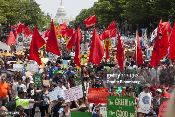 Demonstrators march down Pennsylvania Avenue during the People's Climate Movement March in Washington, D.C., U.S., on Saturday, April 29, 2017....