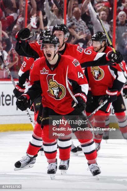 Jean-Gabriel Pageau of the Ottawa Senators celebrates his third period game tying goal and hattrick against the New York Rangers with teammates Mark...