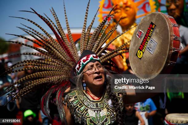 Native Americans perform a tribal ceremony before a peace rally at the intersection of Florence and Normandie, on the 25th anniversary of the LA...