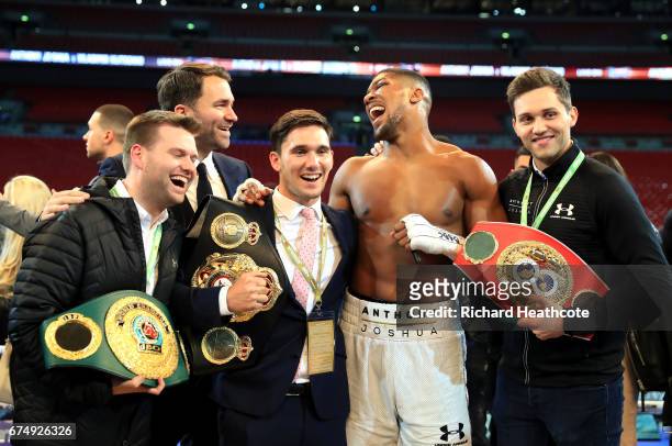 Anthony Joshua celebrates with his management team after victory over Wladimir Klitschko in the IBF, WBA and IBO Heavyweight World Title bout at...
