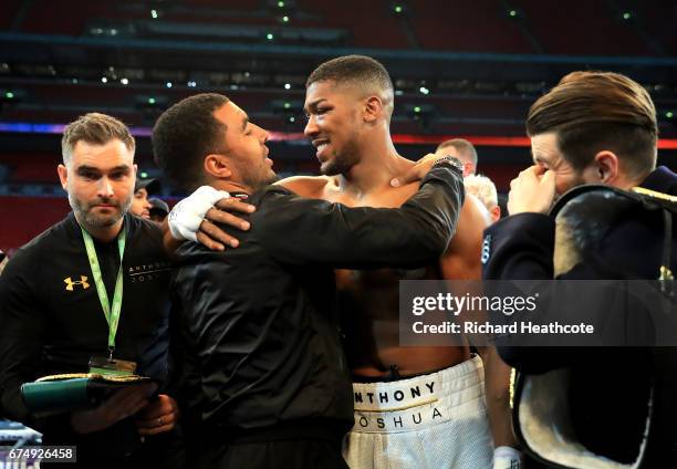 Anthony Joshua celebrates with footballer, Troy Deeney after victory over Wladimir Klitschko in the IBF, WBA and IBO Heavyweight World Title bout at...